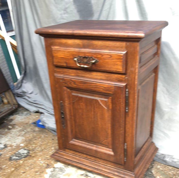 NARROW DARK OAK JAM CABINET WITH NOTCHED RETANGULAR PANEL