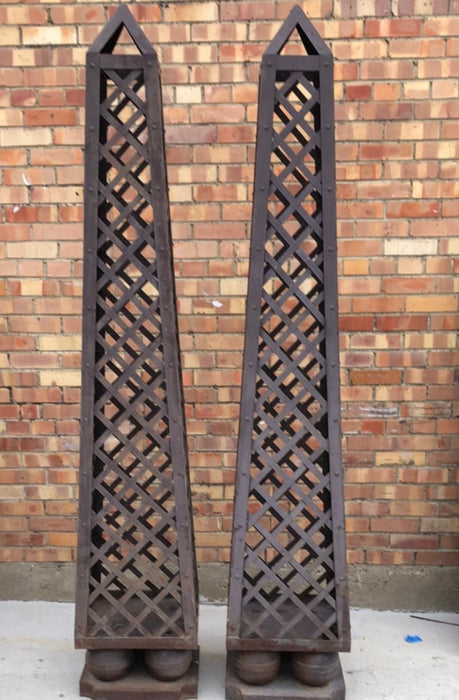 PAIR OF TALL METAL OBELISKS