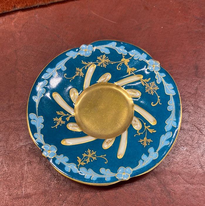 BLUE, GOLD, AND WHITE DEMITASSE CUP AND SAUCER