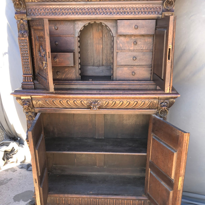 CARVED 2-PIECE OAK BRUEGHEL CABINET WITH FITTED INTERIOR