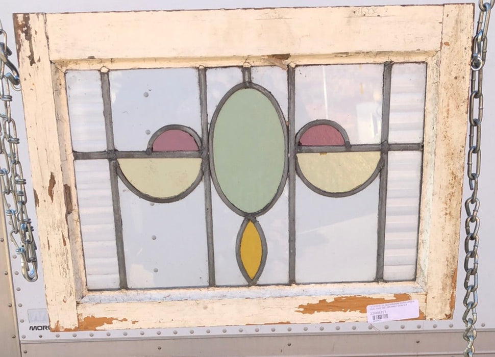 STAINED GLASS WINDOW WITH GREEN OVAL AND YELLOW HALF OVALS