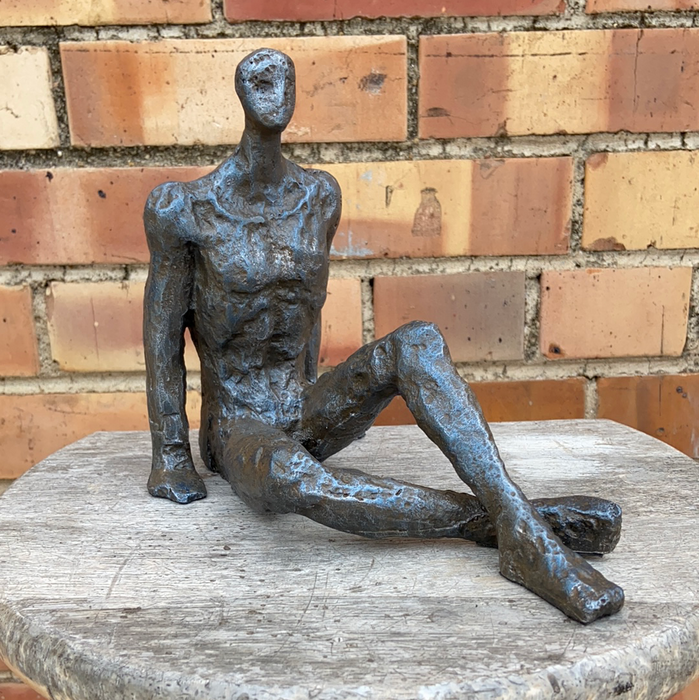 SMALL NOT OLD IRON FREEFORM SITTING MAN FIGURE