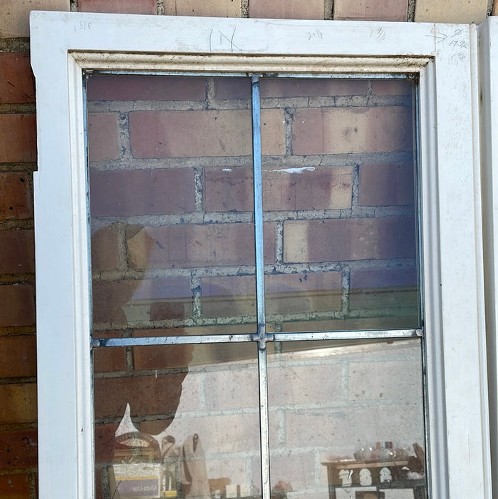 PAIR OF VERTICAL NARROW LEADED GLASS WINDOWS WITH RECTANGULAR PANES