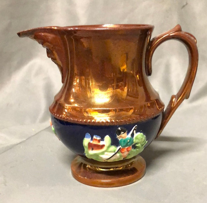 SMALL COPPER LUSTER PITCHER WITH MAN