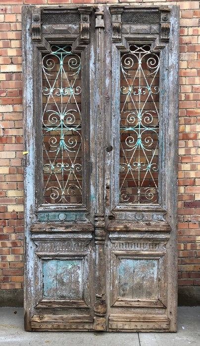 PAIR OF TALL EGYPTIAN DOORS WITH WROUGHT IRON DETAILS