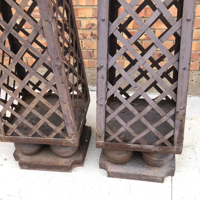 PAIR OF TALL METAL OBELISKS