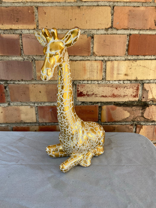 GOLD AND WHITE GIRAFFE FIGURE