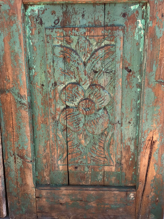 PAIR OF PINE DOORS WITH CARVED FLOWERS AND PARTIAL GREEN PAINT