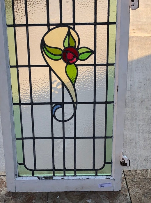 TALL STAINED GLASS WINDOW WITH RED ROSE AND GREEN BORDER