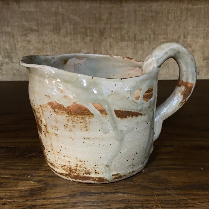 GREEN AND BROWN GLAZED POTTERY PITCHER