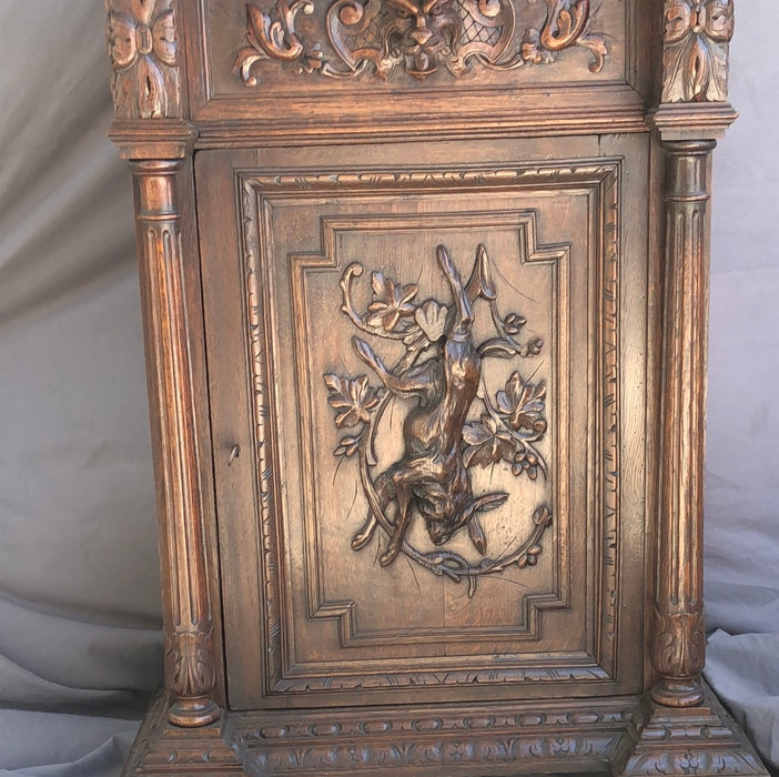 TALL OAK JAM CUPBOARD WITH RABBIT AND LION