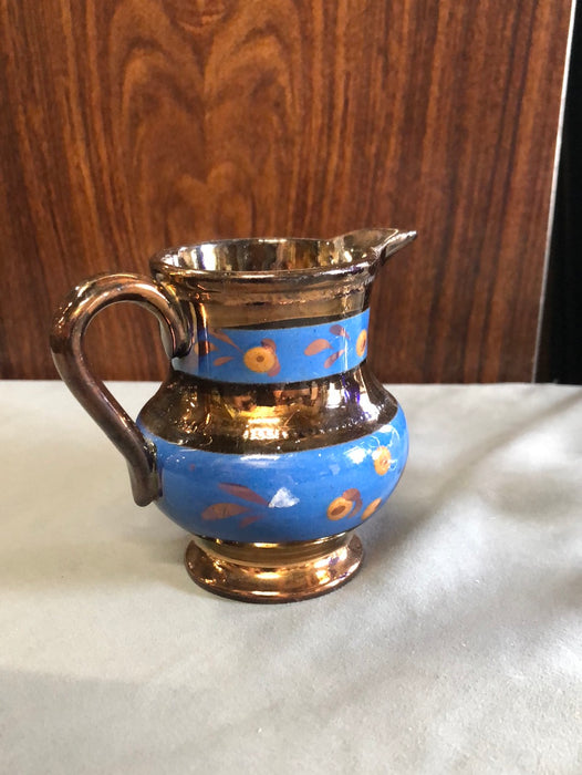 SMALL COPPER LUSTER PITCHER WITH 2 BLUE FLORAL BANDS