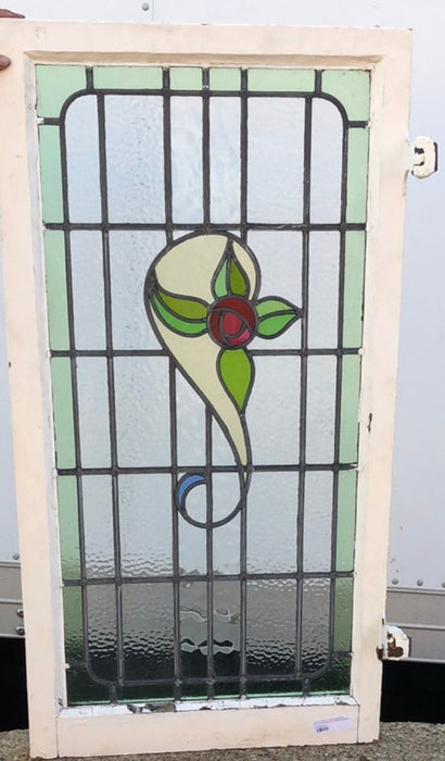 TALL STAINED GLASS WINDOW WITH RED ROSE AND GREEN BORDER