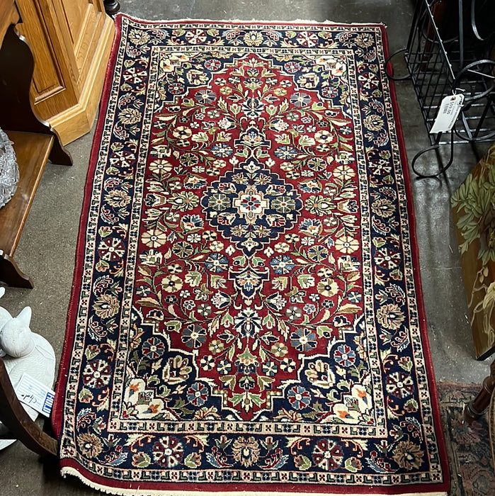 36” X 64” RED AND BLUE HAND TIED RUG