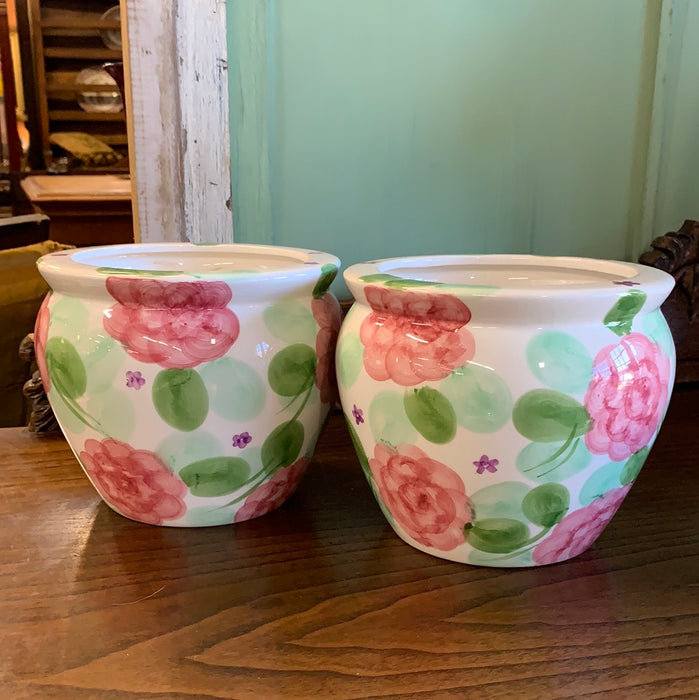 PAIR OF PINK AND GREEN FLORAL PLANTERS