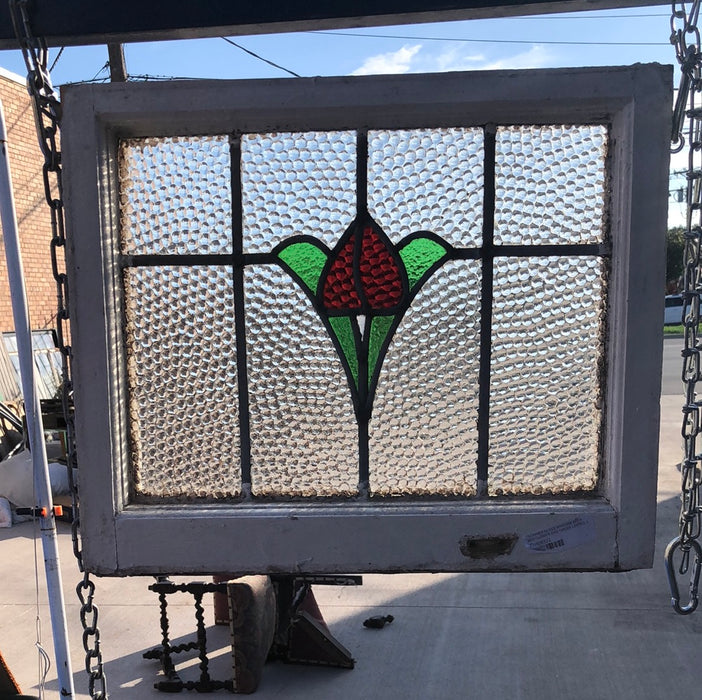 STAINED GLASS WINDOW WITH RED FLOWER AND GREEN LEAVES