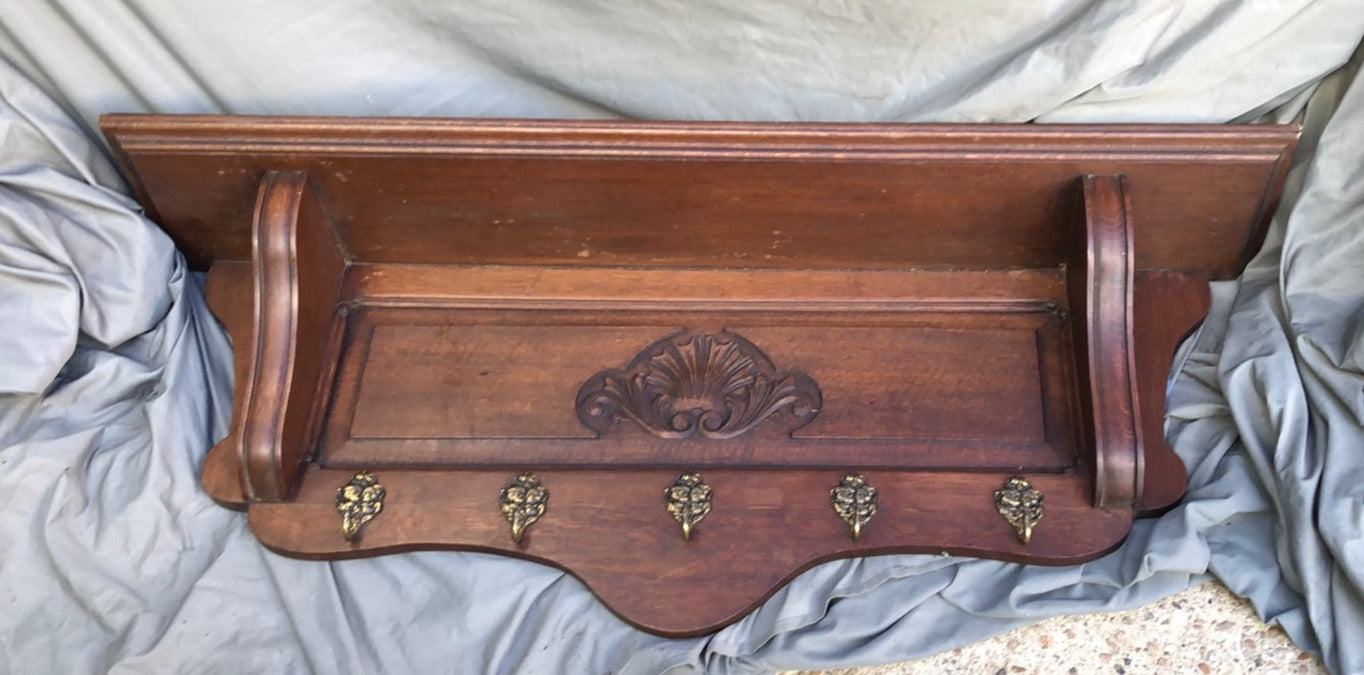 DARK OAK WALL SHELF WITH CENTER CARVED SHELL