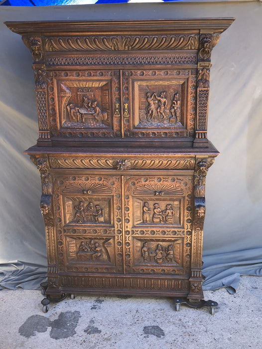 CARVED 2-PIECE OAK BRUEGHEL CABINET WITH FITTED INTERIOR