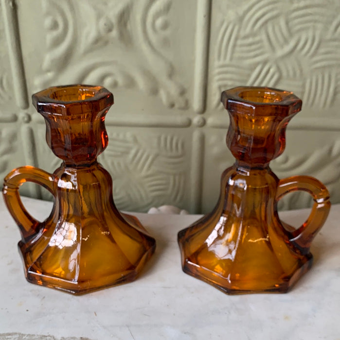 PAIR OF AMBER GLASS CANDLE STICKS