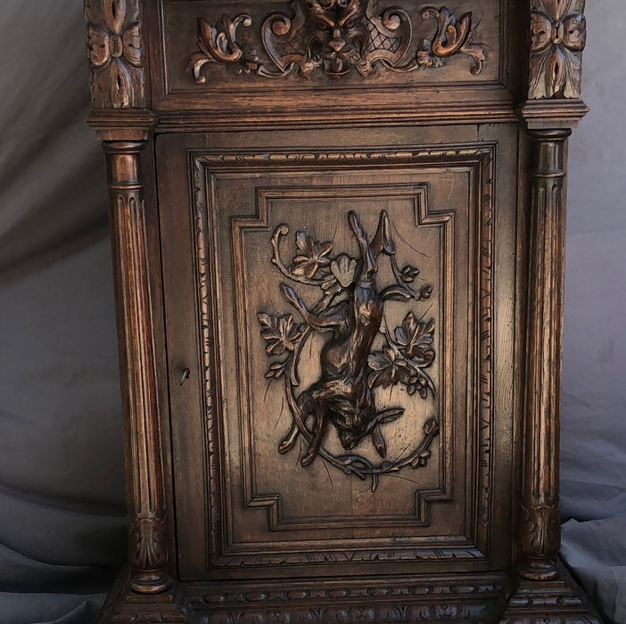 TALL OAK JAM CUPBOARD WITH RABBIT AND LION