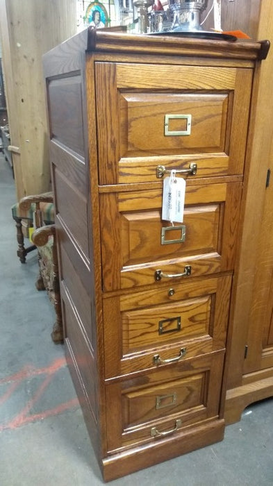 OAK 4 DRAWER FILE CABINET-NOT OLD